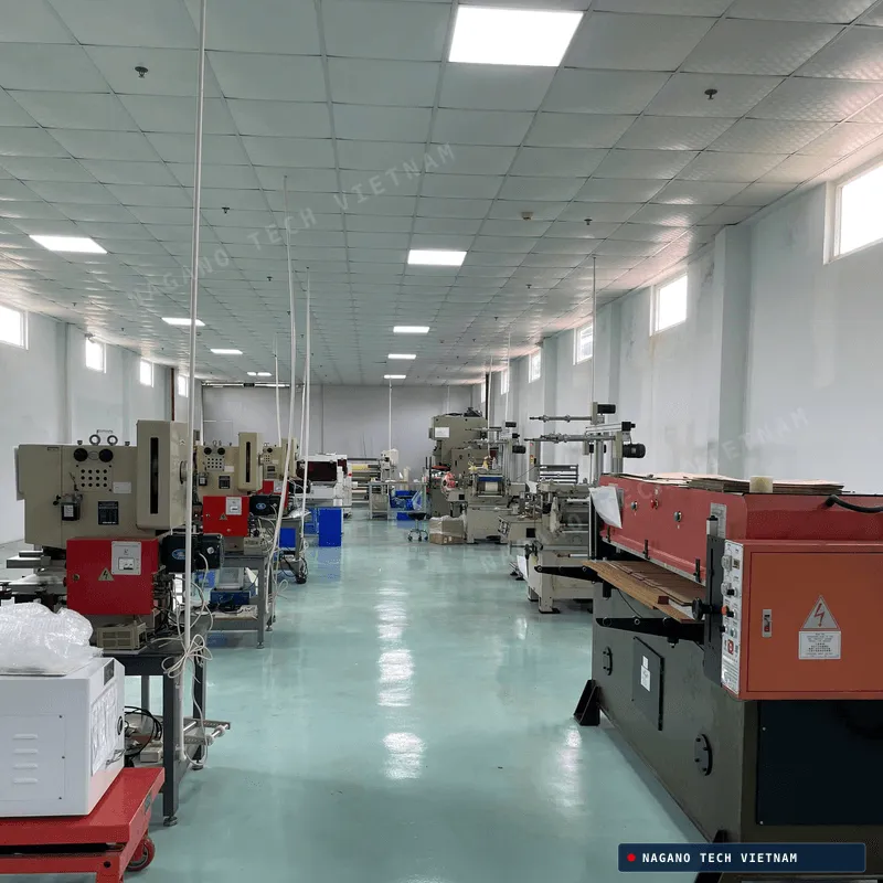 Precision die-cutting machine operating on shiny industrial film